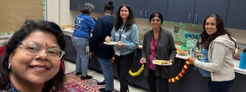 6 women enjoying food celebrating Diwali