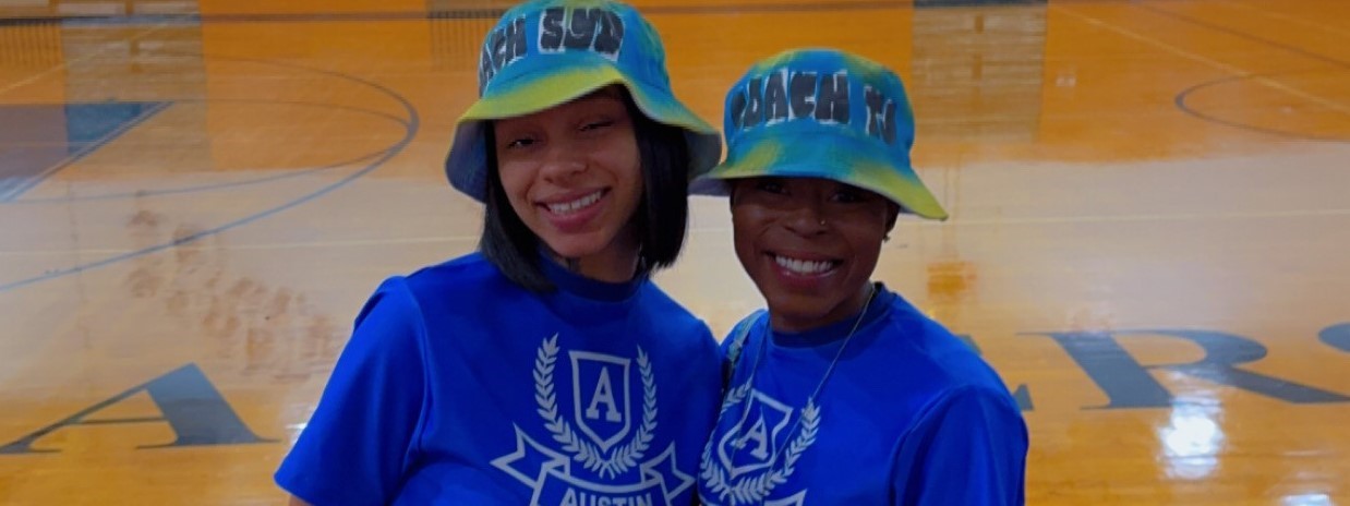 2 women posing with smiles