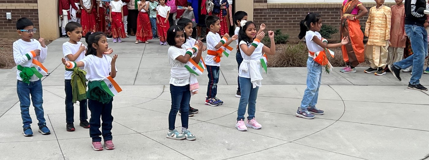 students holding their nationality flag