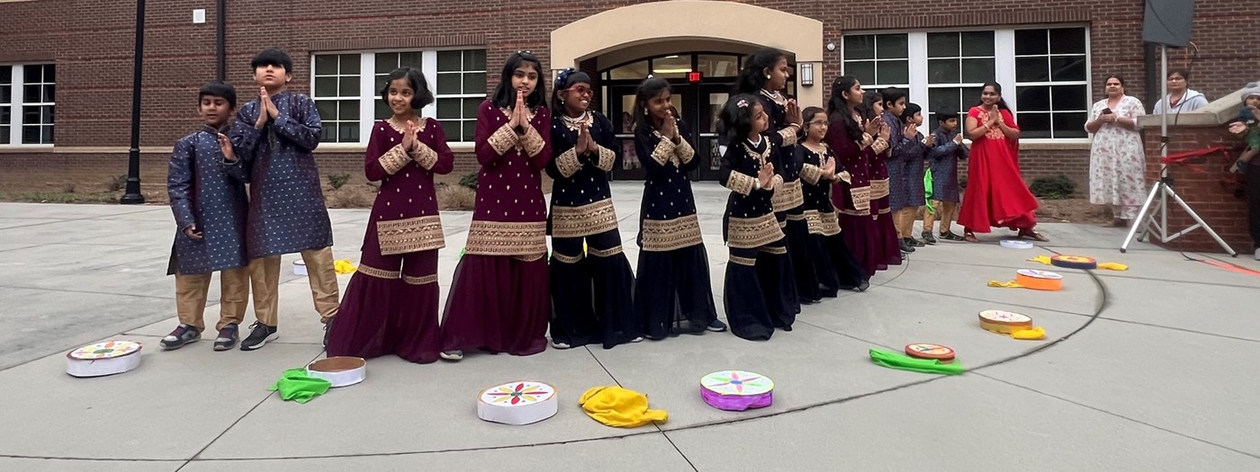 students dancing in their nation&#39;s traditional dress